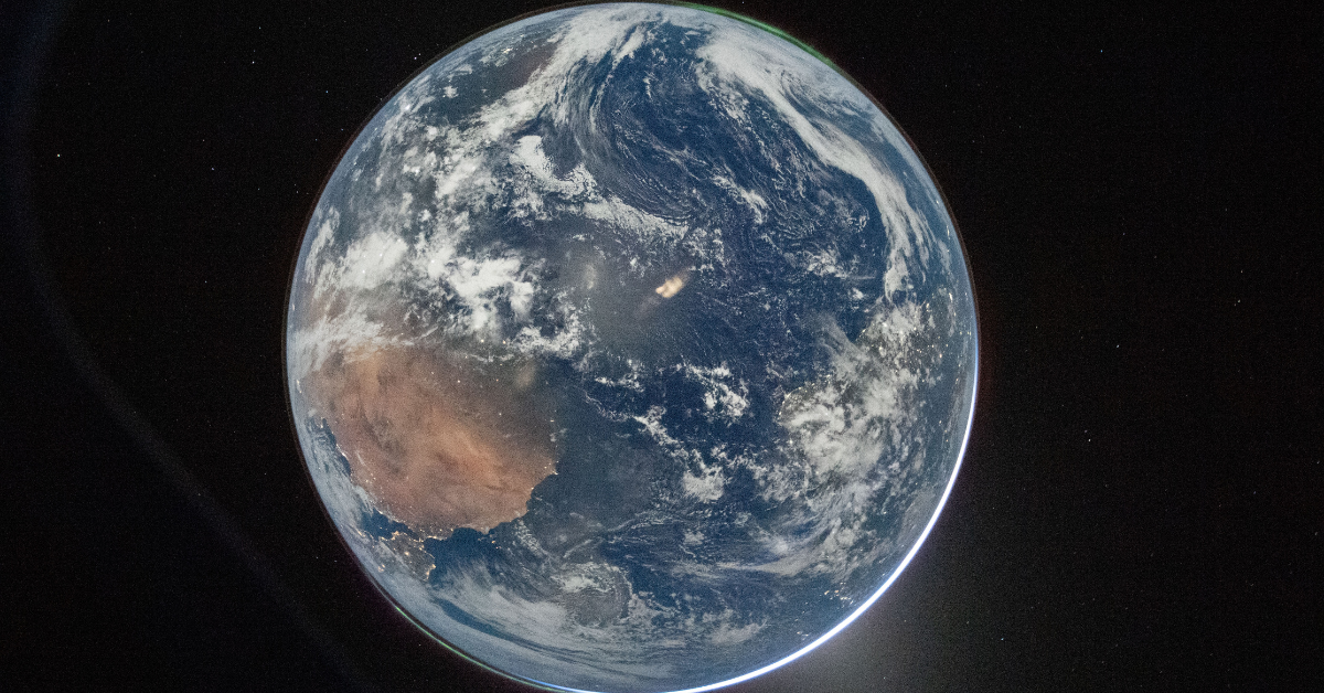 This nighttime picture of Earth was taken on April 2, 2026, by an Artemis II crew member aiming a camera through a window of the Orion spacecraft. The image was captured after Orion completed its translunar injection burn, the critical maneuver that sent the spacecraft on its path toward the Moon and back. Credit: NASA